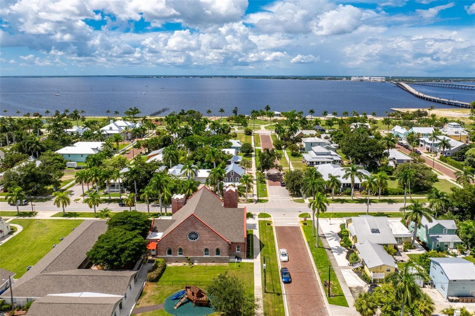 Church with partial view of purple house - 502 W MARION AVE, PUNTA GORDA