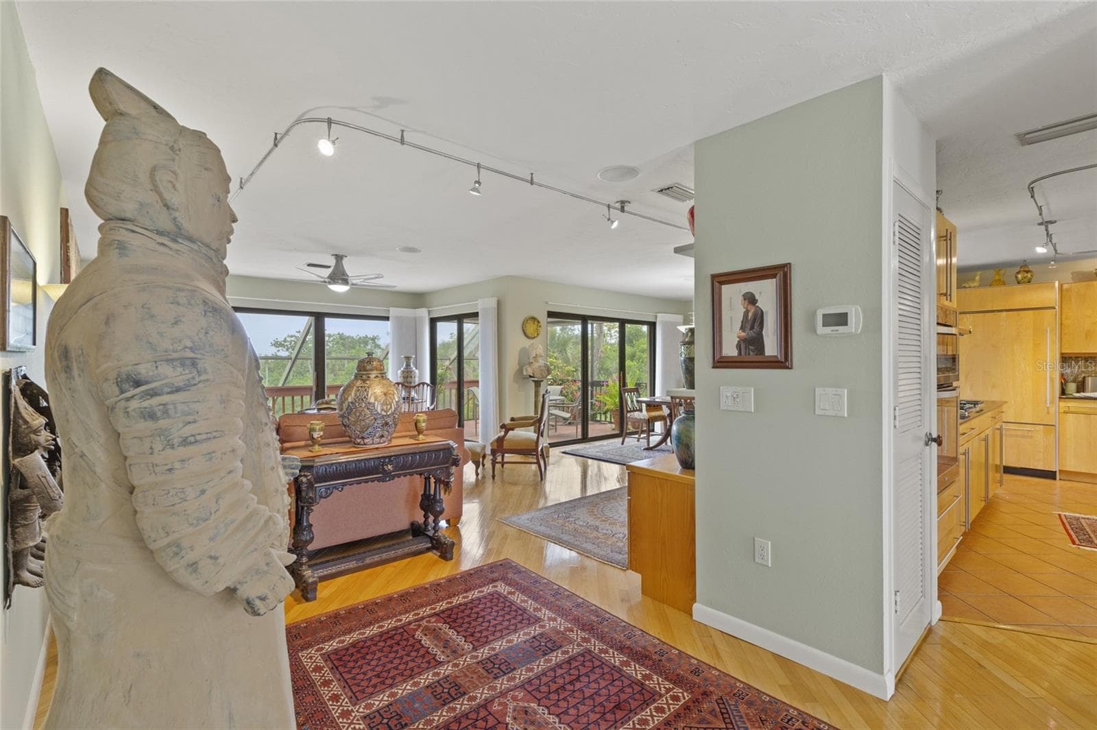 Peek into living, dining and kitchen and porches - 609 42ND STREET CT W, PALMETTO