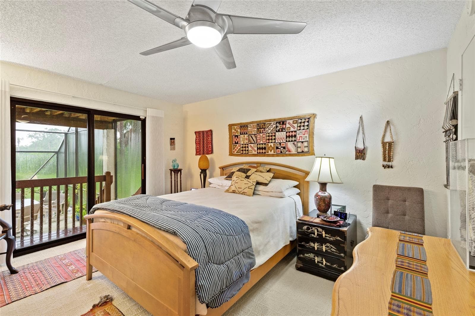 bedroom 4 on first floor with private access to pool - 609 42ND STREET CT W, PALMETTO