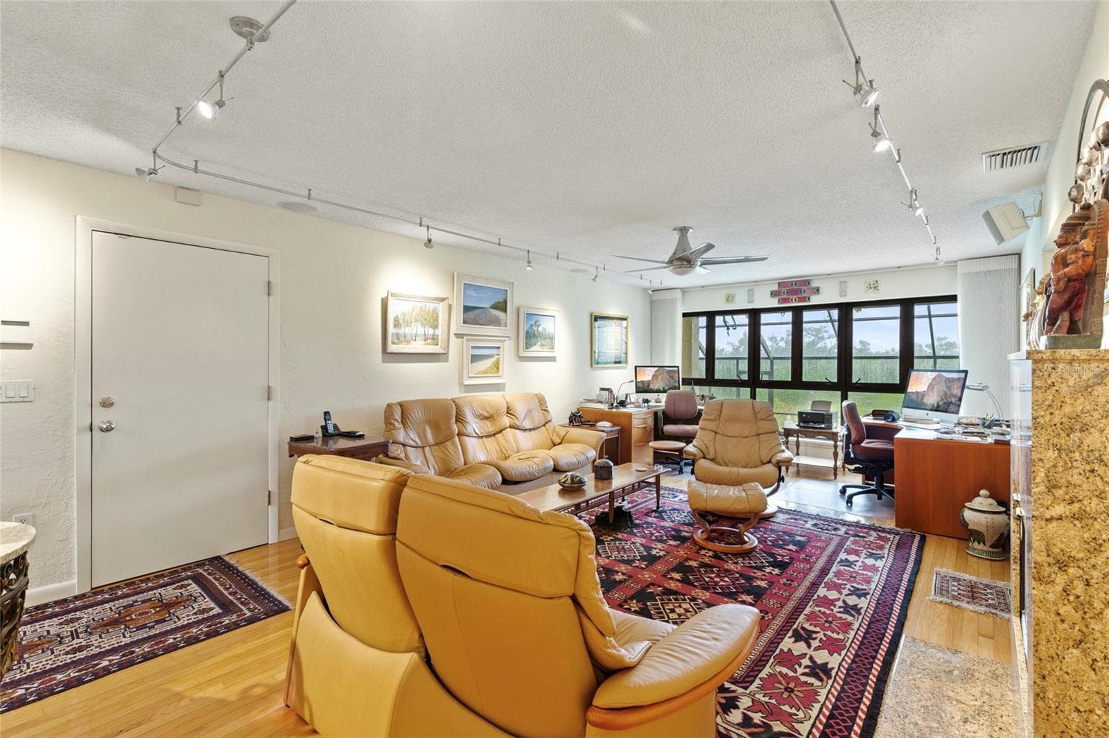 living room first floor.  Door to left access to garage - 609 42ND STREET CT W, PALMETTO
