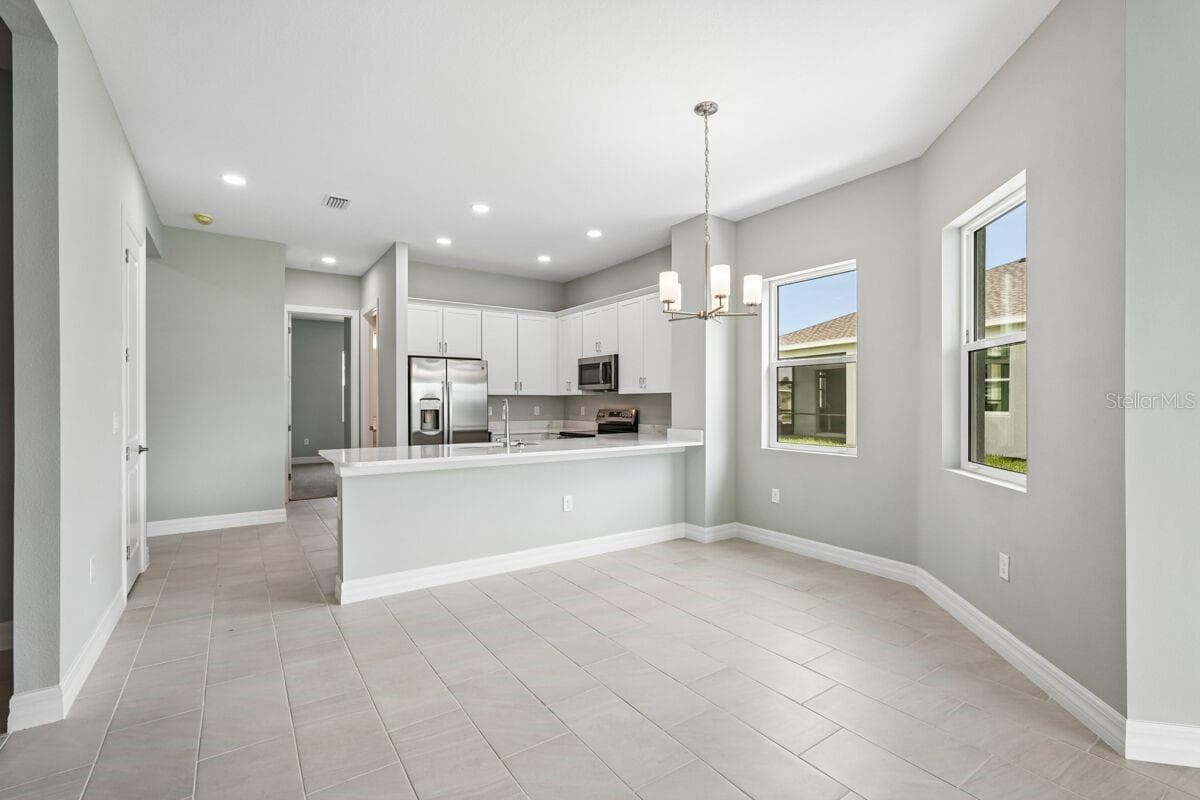 Kitchen-Photo description represents the model home of same floor plan. - 1847 NOTTINGHAM TRL, PORT CHARLOTTE