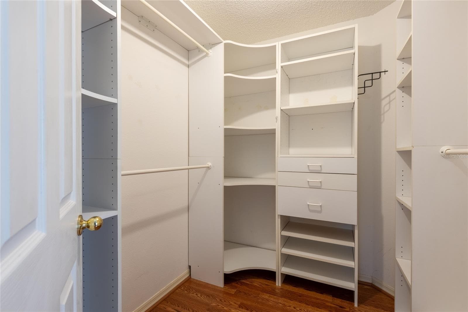 Primary bedroom closet with lots of storage! - 10274 OASIS PALM DR, TAMPA