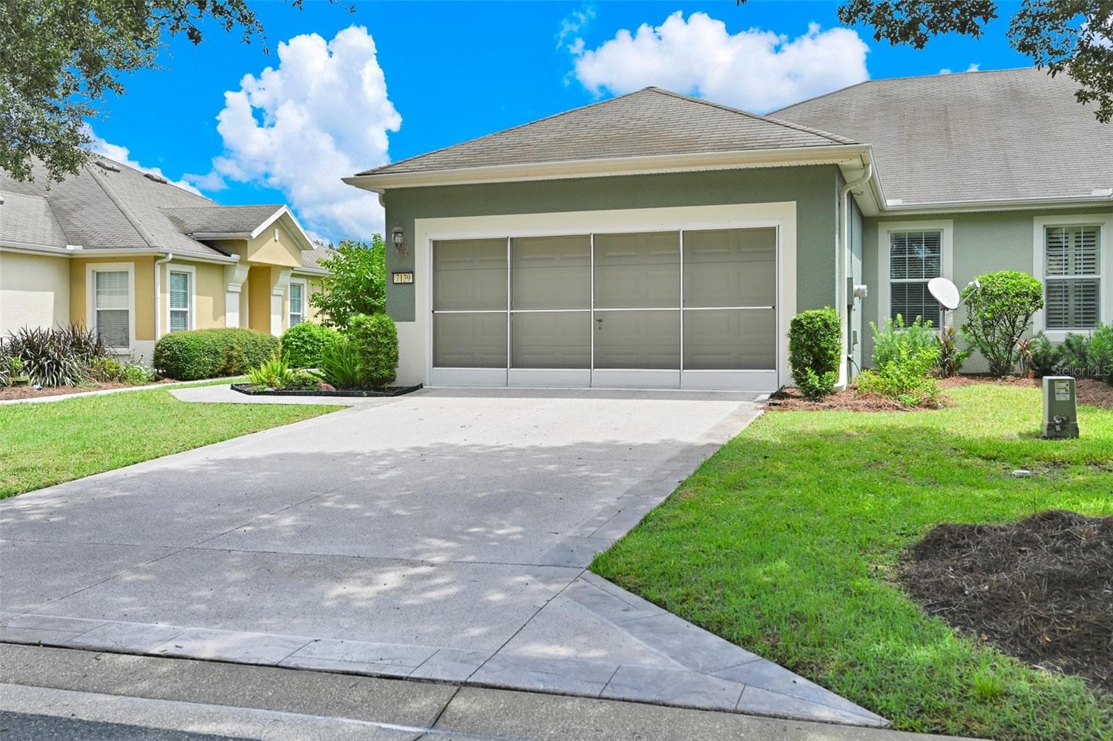 Epoxied Driveway, Walkway & Insulated Garage Door with Screen - 7139 SW 91ST CT, OCALA