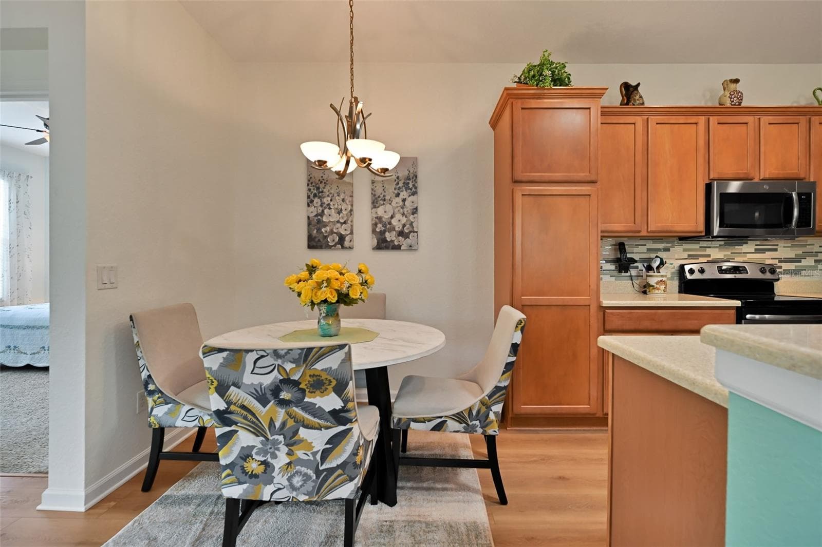 Dinette Area with chandelier - 7139 SW 91ST CT, OCALA