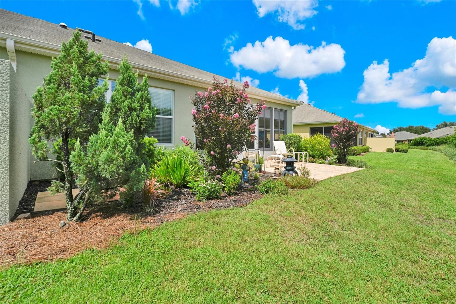 Rear private outdoor paver patio & garden area - 7139 SW 91ST CT, OCALA