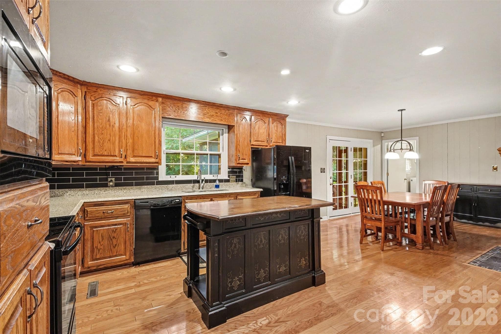 The open Kitchen and Dining Area is perfect for family gatherings and entertaining friends - 113 Brookshire Avenue, Kannapolis