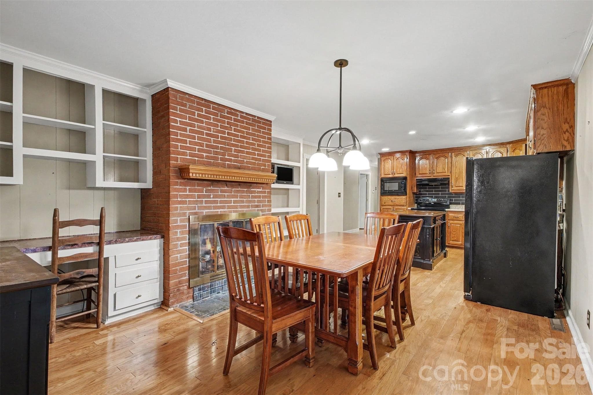 Built-ins on both sides of the fireplace is great for storage and work space - 113 Brookshire Avenue, Kannapolis