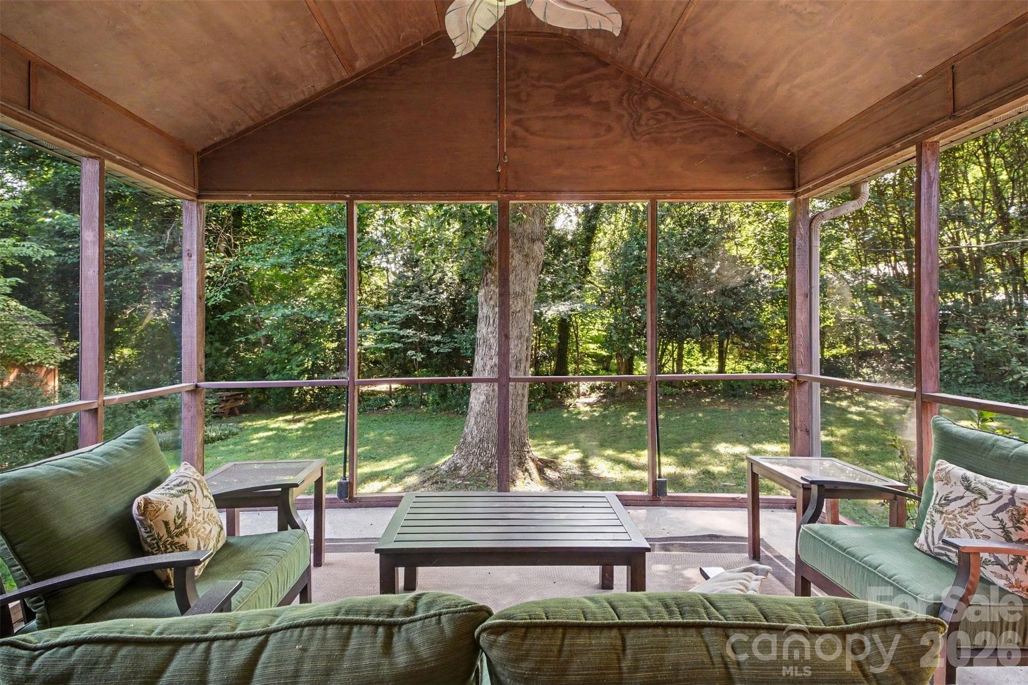 What a Lovely View off the Screened Back Porch accented with a ceiling fan to keep you nice and cool. - 113 Brookshire Avenue, Kannapolis