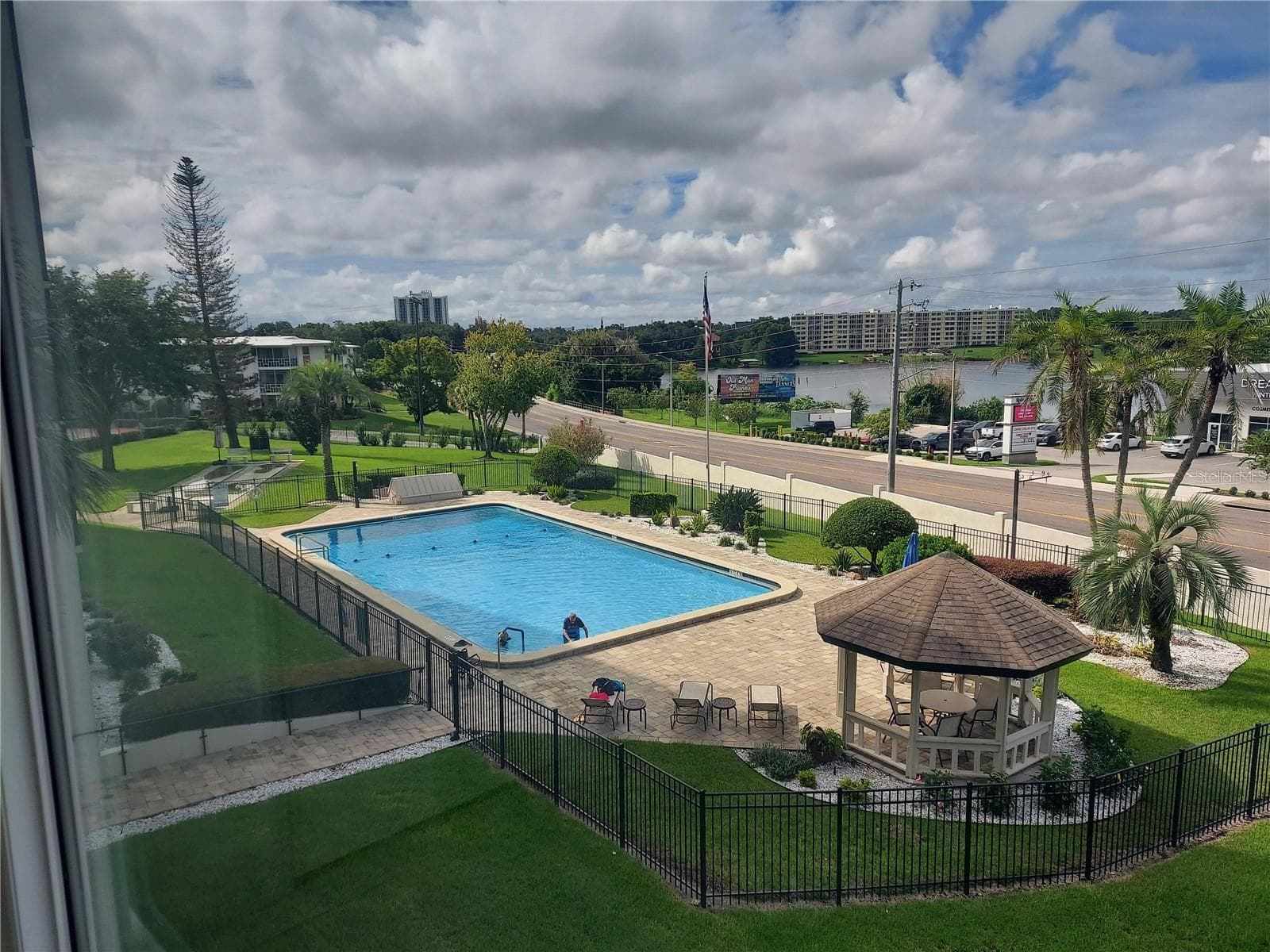 Condo view of pool and lake - 1776 6TH ST NW #304, WINTER HAVEN