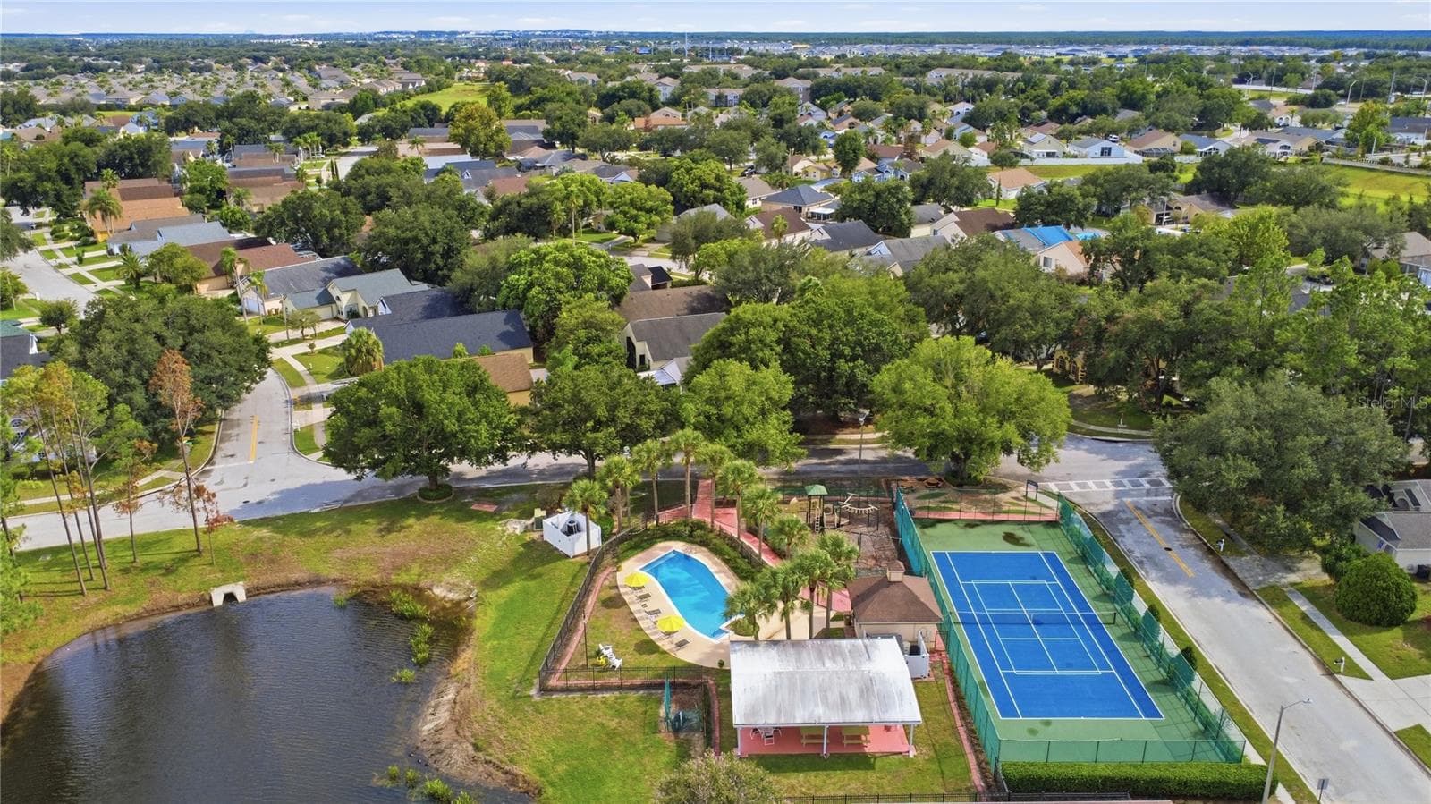 Community recreation area featuring a pool, tennis and playground. - 2117 FISH EAGLE ST, CLERMONT