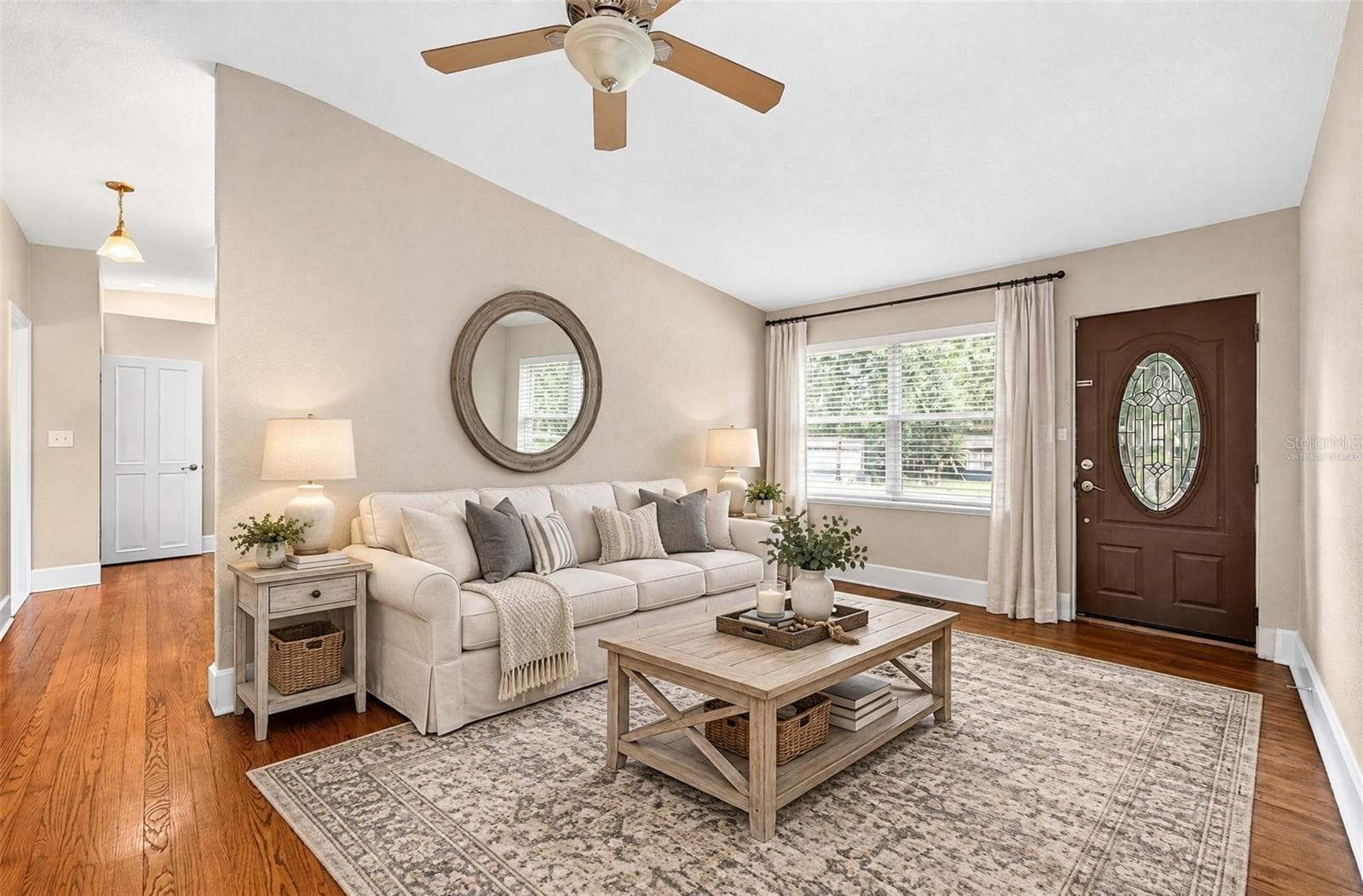 Formal living at the front of the home flows into the updated kitchen. Virtually Staged. - 1212 ELMWOOD ST, ORLANDO