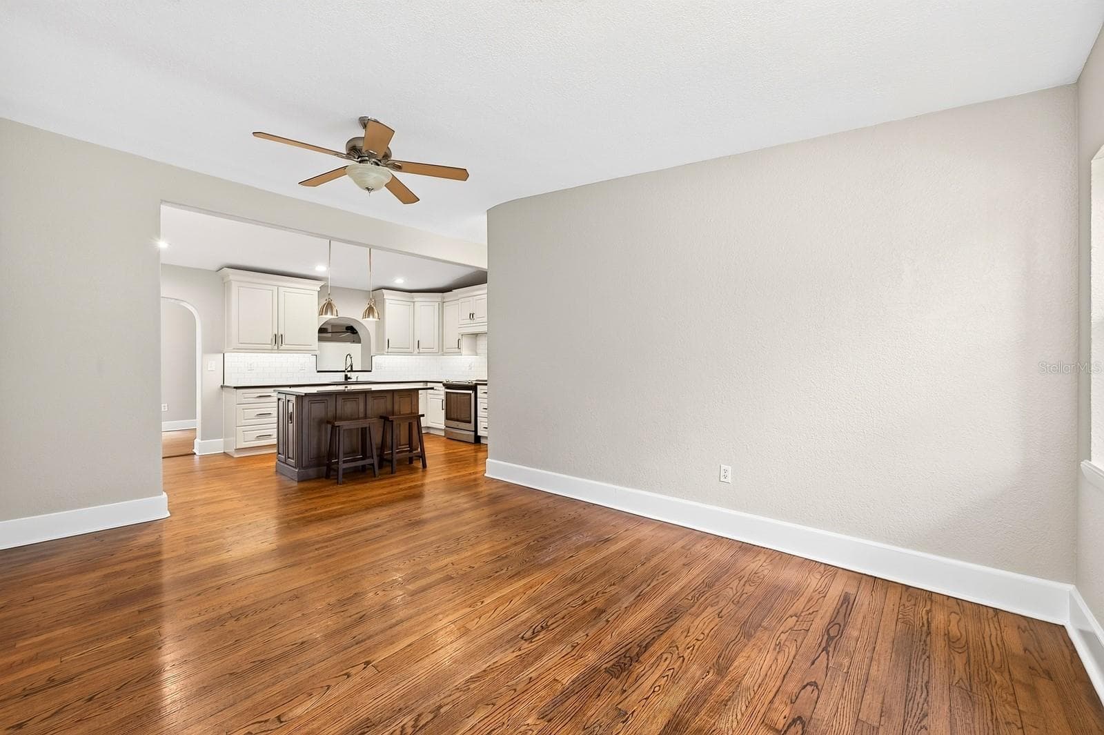Formal living at the front of the home flows into the updated kitchen. - 1212 ELMWOOD ST, ORLANDO