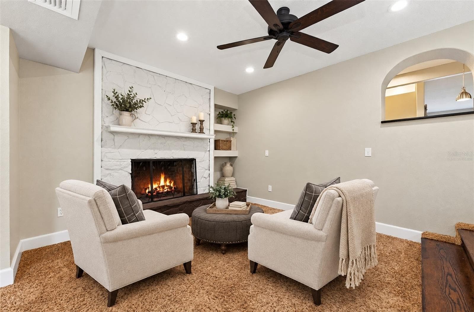 The first area of the family room features a fireplace feature wall. Virtually Staged. - 1212 ELMWOOD ST, ORLANDO
