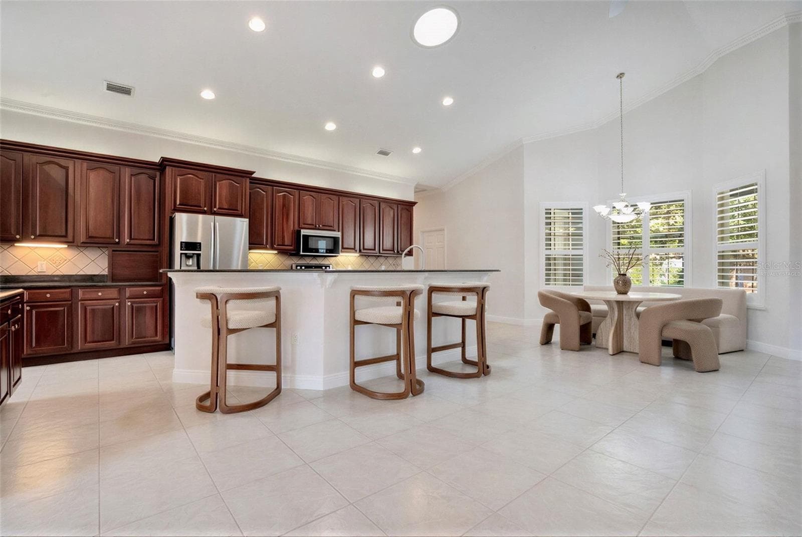 Breakfast Nook and Kitchen - Virtually Staged - 5365 SHADY OAK CIR, ST CLOUD
