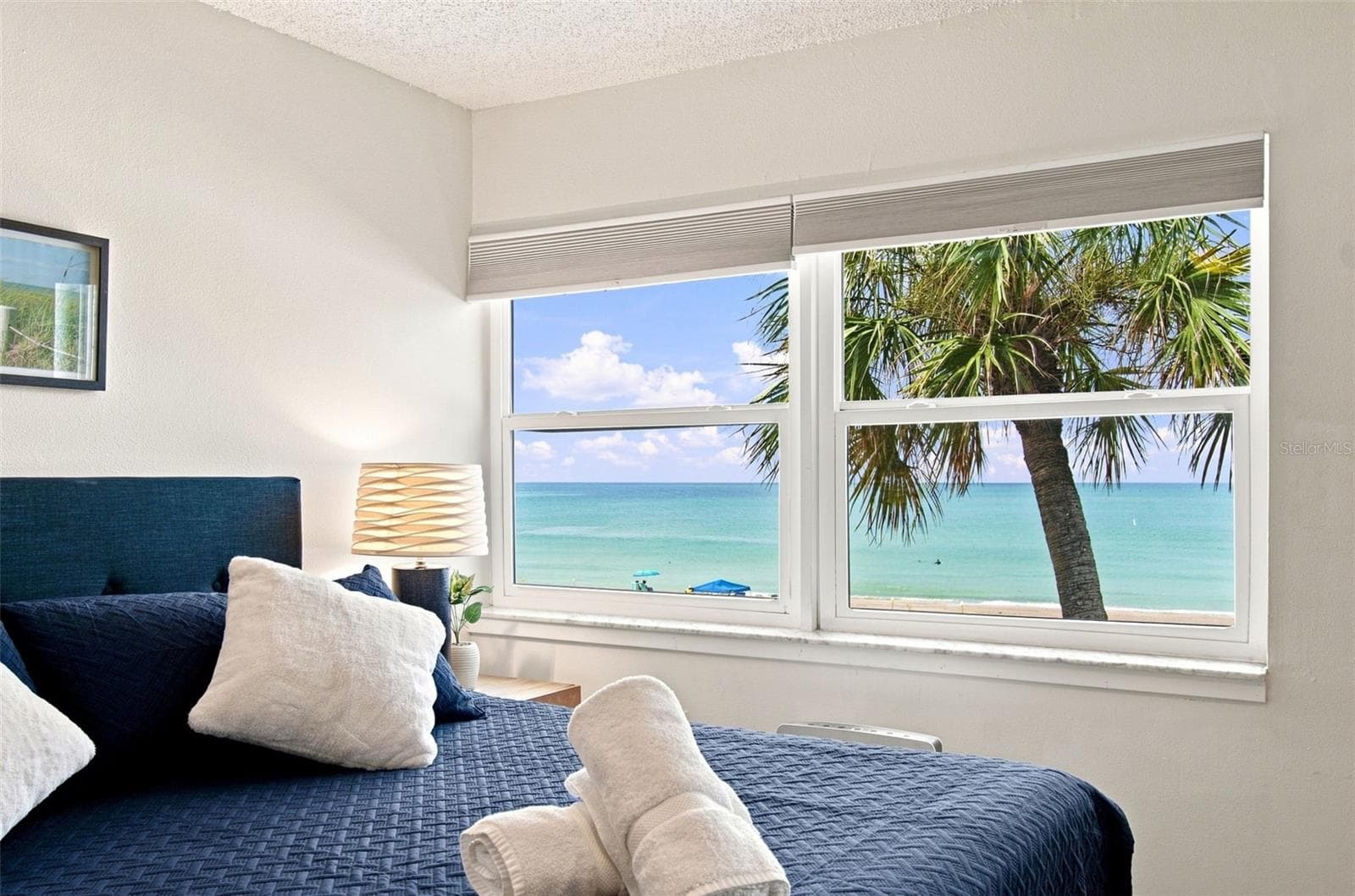 Primary bedroom with view of the beach - 60 GULF BLVD #214, INDIAN ROCKS BEACH