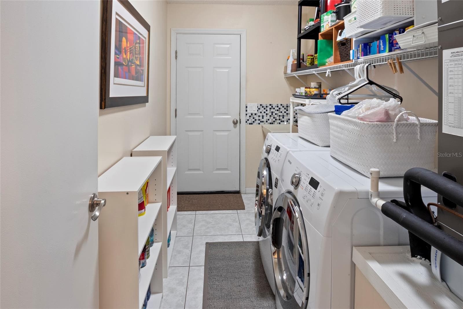 Inside Laundry with storage. - 672 SAN PEDRO DR, THE VILLAGES