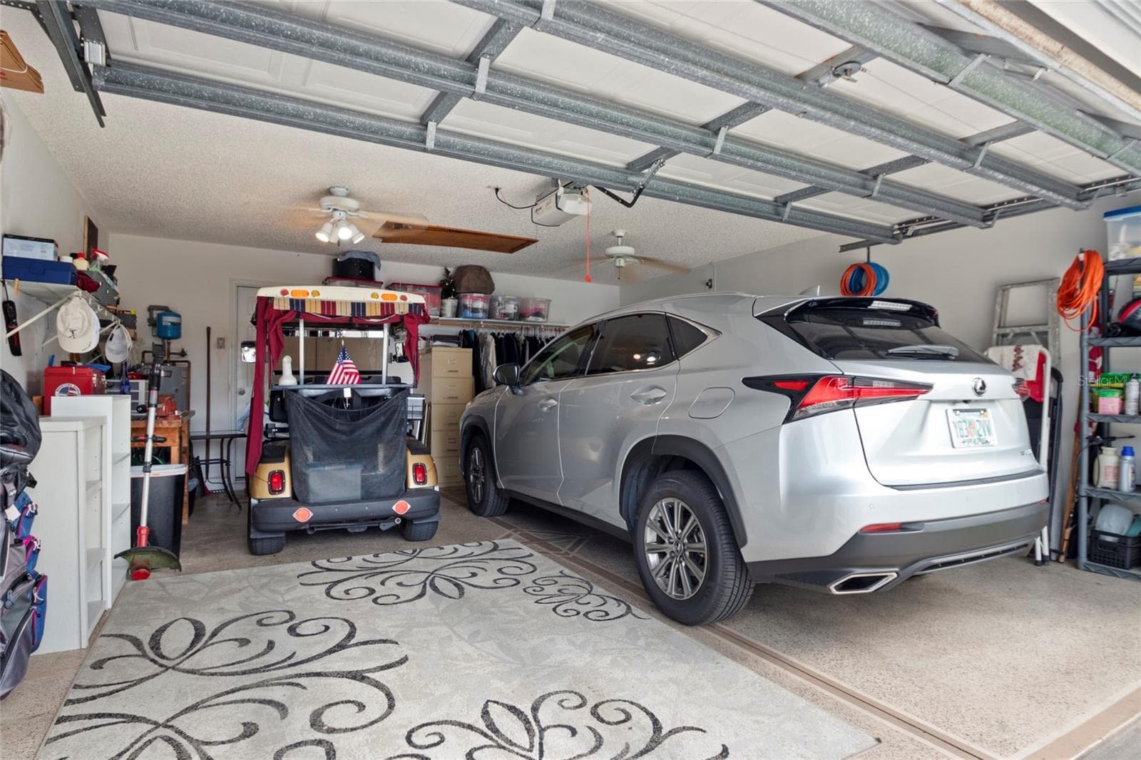 Garage has room for a vehicle and two golf carts. - 672 SAN PEDRO DR, THE VILLAGES