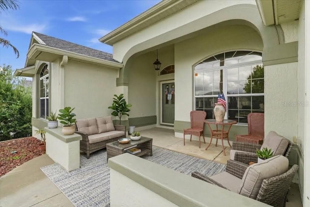 front patio, virtual staged - 438 TROY LOOP, THE VILLAGES
