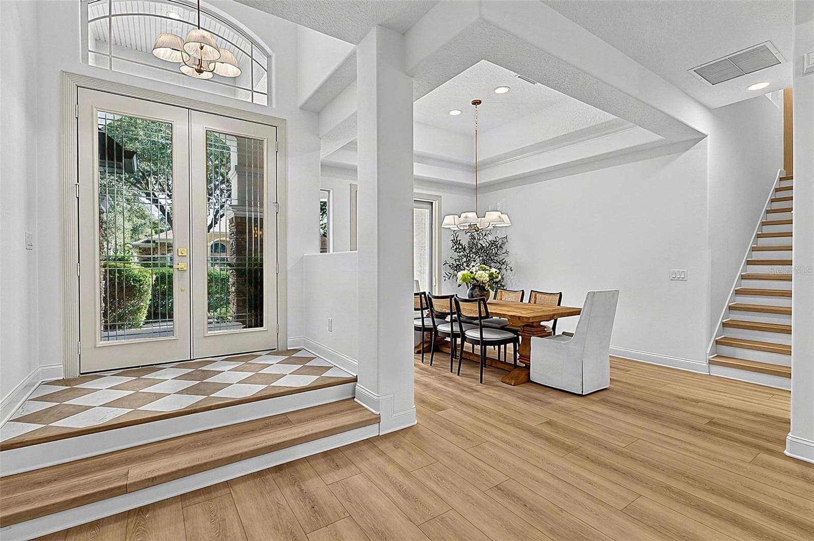 Front Elegant Foyer/ Formal Dining Room / staircase to 4th Bedroom/ flex room - 17 GRANDVIEW DR, PALM COAST