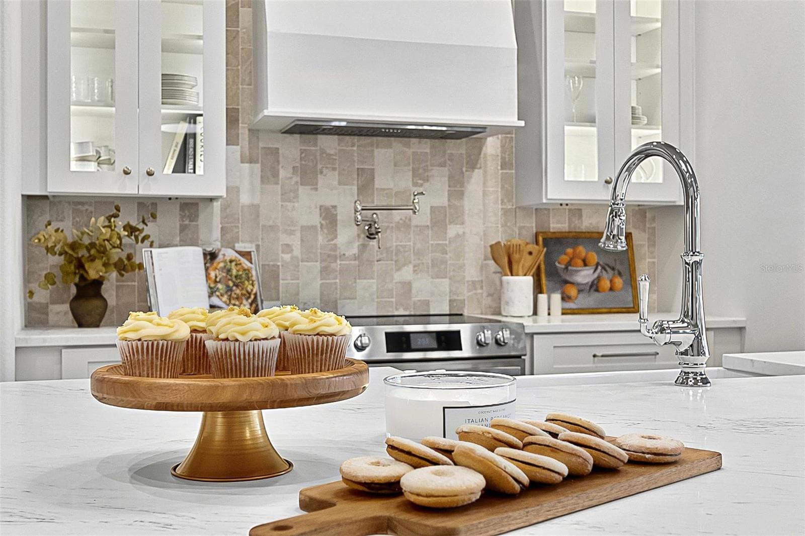 Elegant Centerpiece Kitchen Island with crafted wall of tile and lighted window cabinets - 17 GRANDVIEW DR, PALM COAST