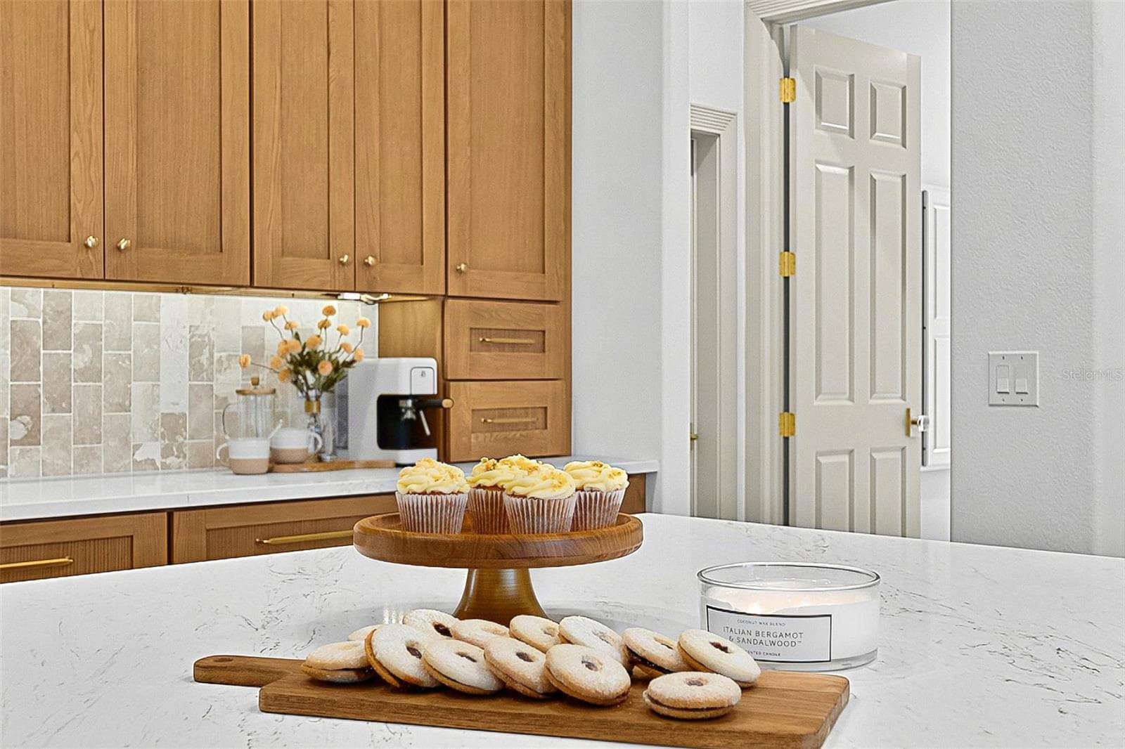 Kitchen Island Centerpiece with wall of custom wood cabinets - 17 GRANDVIEW DR, PALM COAST