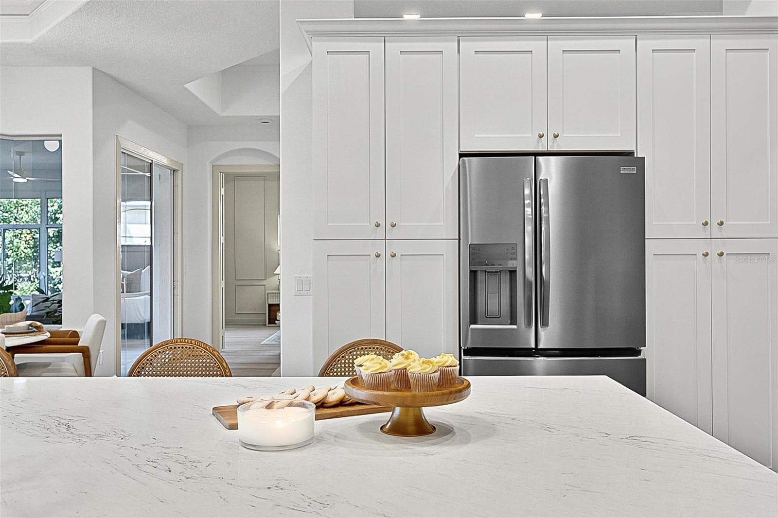 Kitchen Island with farm sink, showing refrigerator with wall of pantry cabinets - 17 GRANDVIEW DR, PALM COAST