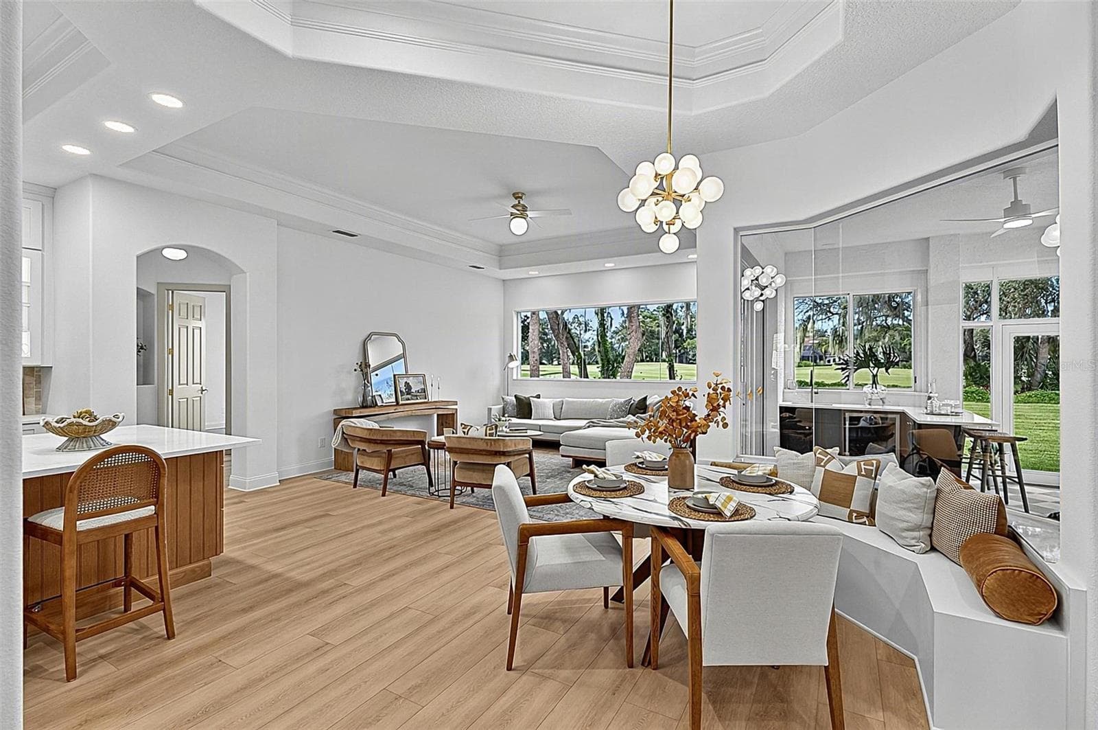 Spectacular Kitchen, cozy breakfast nook with bench setting, seamless window looking out to soliarium and family room with wall of windows for an execlant view of backyard and golf course - 17 GRANDVIEW DR, PALM COAST
