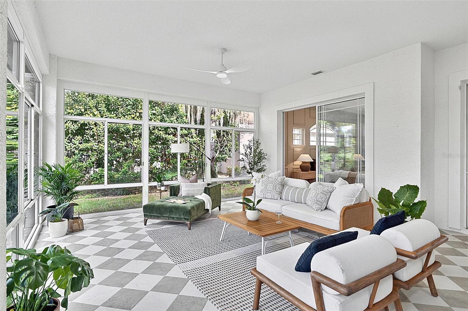 Peaceful Solarium with wall to wall enclosed screened windows looking out on to backyard and golf course. Room is aired - 17 GRANDVIEW DR, PALM COAST
