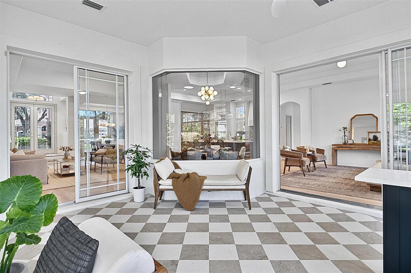 Peaceful Solarium with wall to wall enclosed screened windows looking out on to backyard and golf course. Room is aired and is open to Formal living room and family room - 17 GRANDVIEW DR, PALM COAST