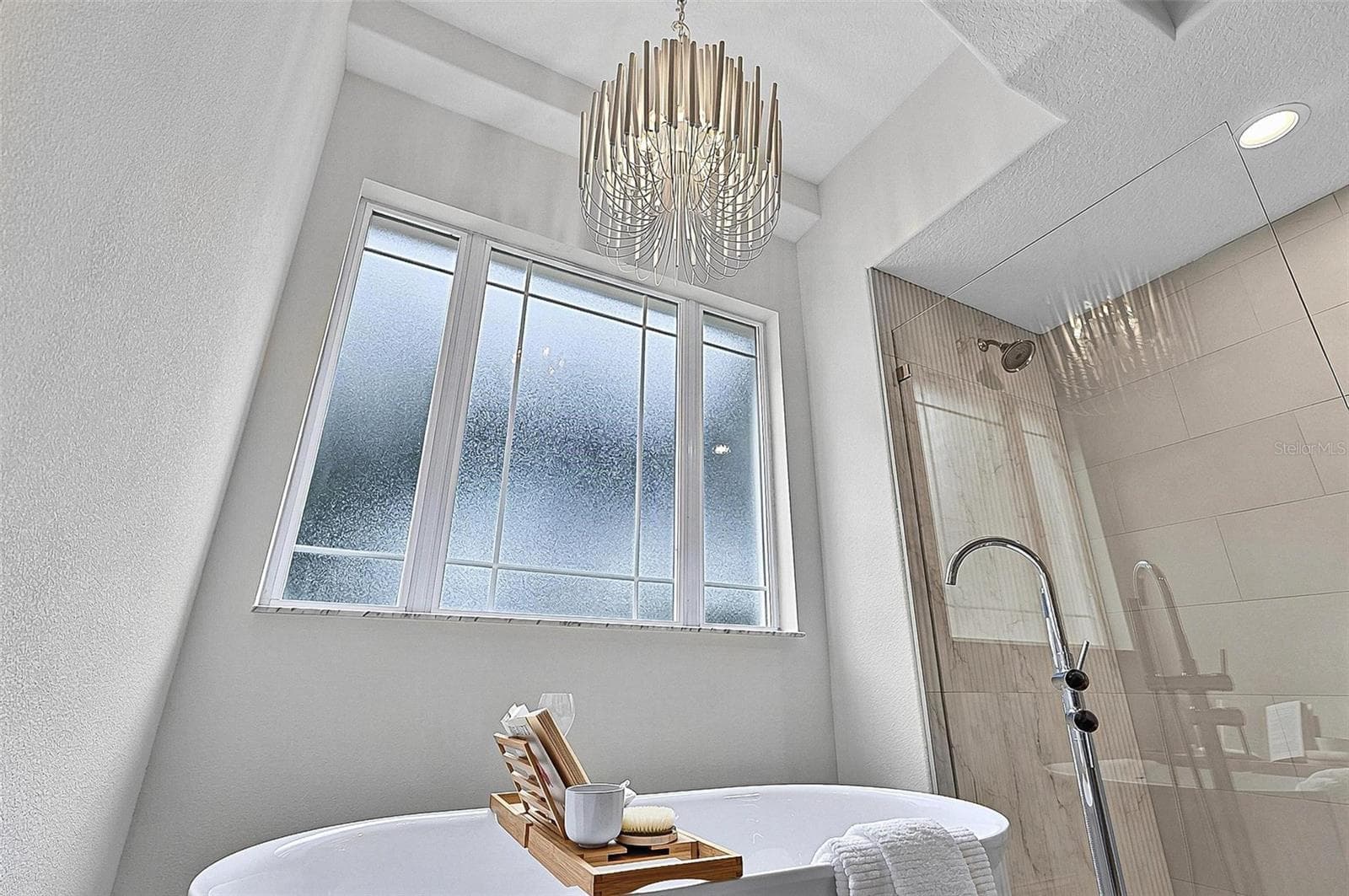 Beautiful chandelier drops over the free standing tub for a nigh time spa glow - 17 GRANDVIEW DR, PALM COAST