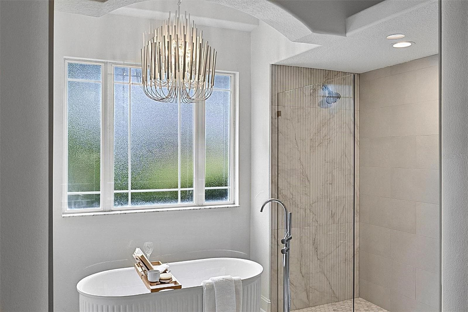 Beautiful chandelier drops over the free standing tub for a nightime spa glow - 17 GRANDVIEW DR, PALM COAST