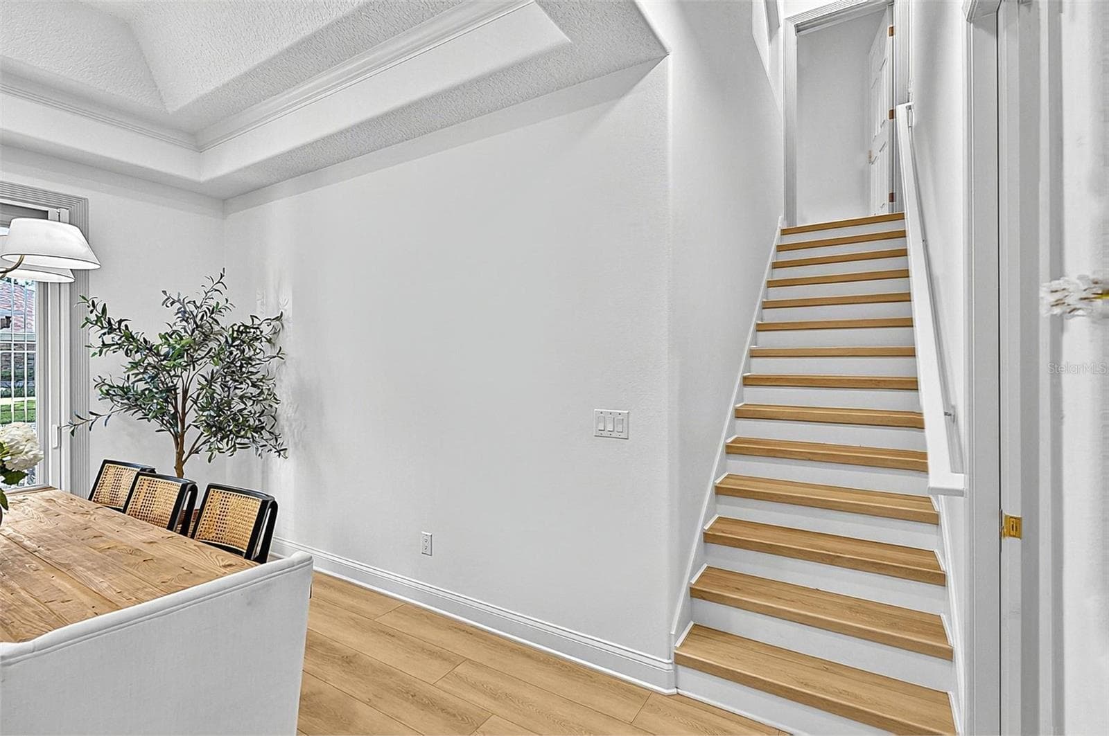 Formal Dining room with stairway to 4th Bedroom with en-suite - 17 GRANDVIEW DR, PALM COAST