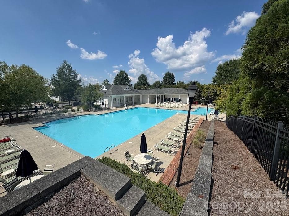 There is a lap pool, a kid splash pool and another swimming area. - 13913 Helen Benson Boulevard, Davidson