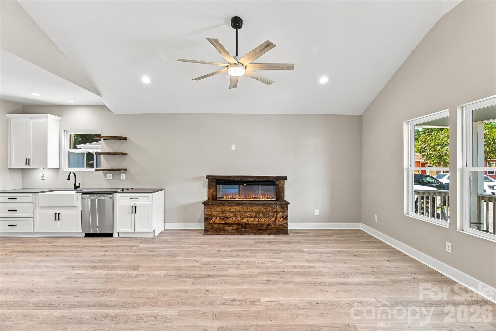 Natural light enhanced with vaulted ceiling in kitchen and living space - 156 Edwards Avenue, Swannanoa
