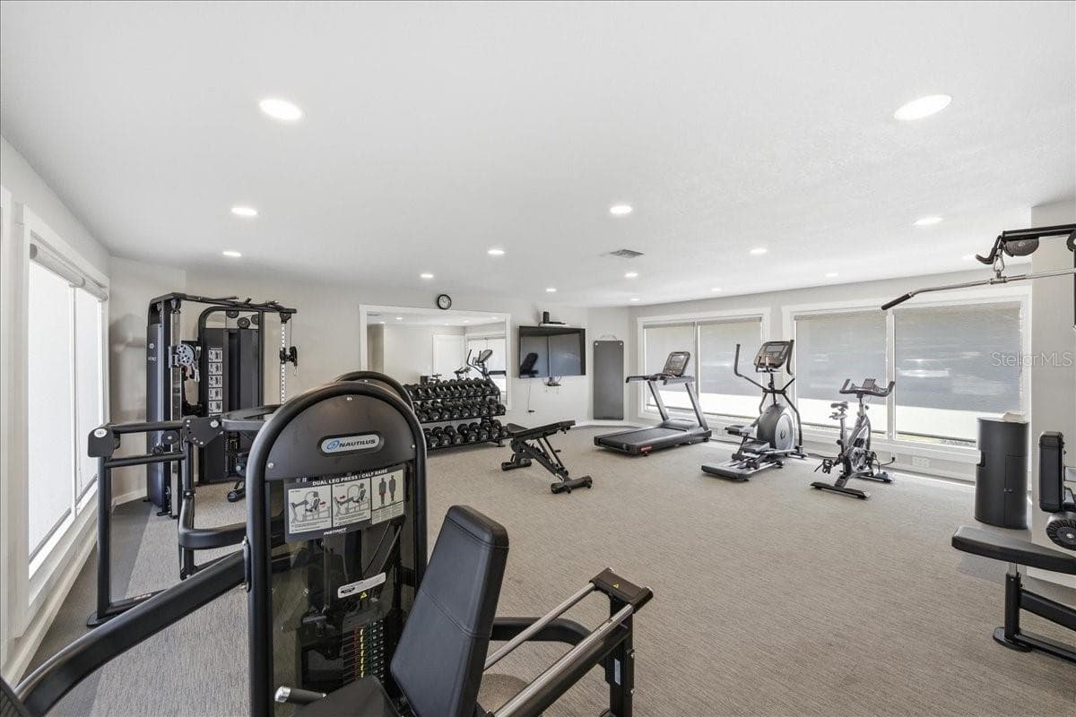 Resort-style amenities include two pools and spa, tennis courts, an exercise facility, putting green, fishing pier, kayak storage and launch, recreational clubhouse, waterfront nature walking trail, and grill and picnic areas. - 1805 MARINER DR #51, TARPON SPRINGS