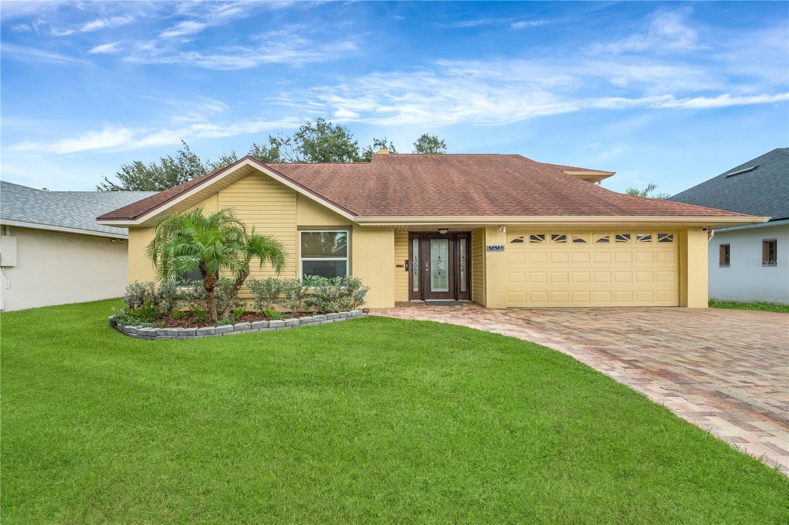 Numerous improvements offer added peace of mind, including impact windows (2018), roof (2018), upgraded A/C (2017), hot water heater (2020), kitchen remodel (2023), second-floor bathroom remodel (2023), upstairs carpet (2023), downstairs carpet (2024), upgraded pool pump (2026), and first-floor toilet replacement (2026). The pool and spa are heated by propane, and the home also features a water softener and security system. - 1418 SHELL FLOWER DR, BRANDON