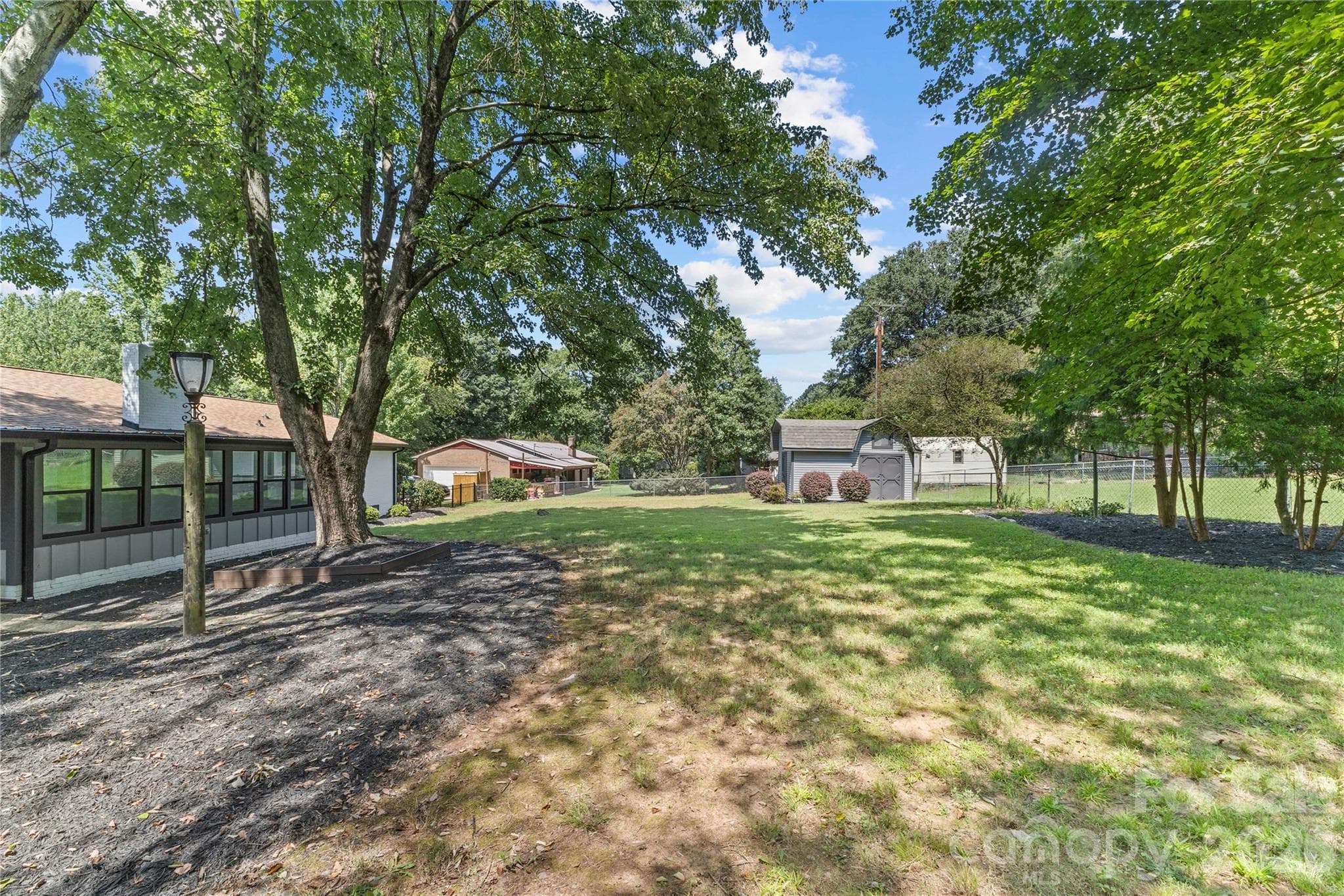 spacious fenced in backyard - 614 S Magnolia Street, Mooresville