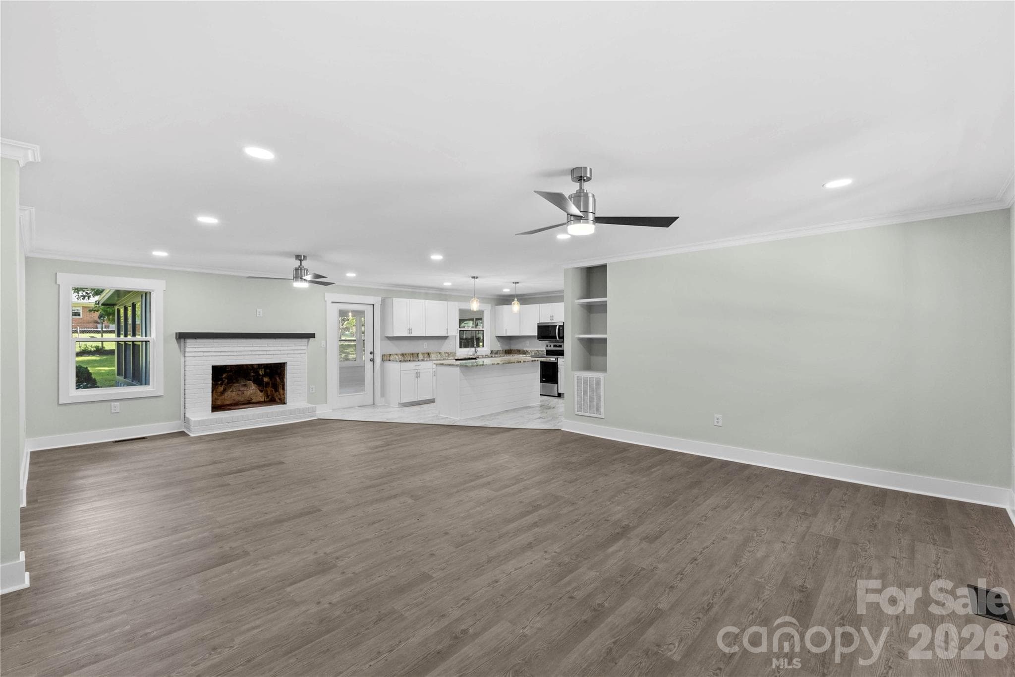 Great room with luxury vinyl plank flooring - 614 S Magnolia Street, Mooresville