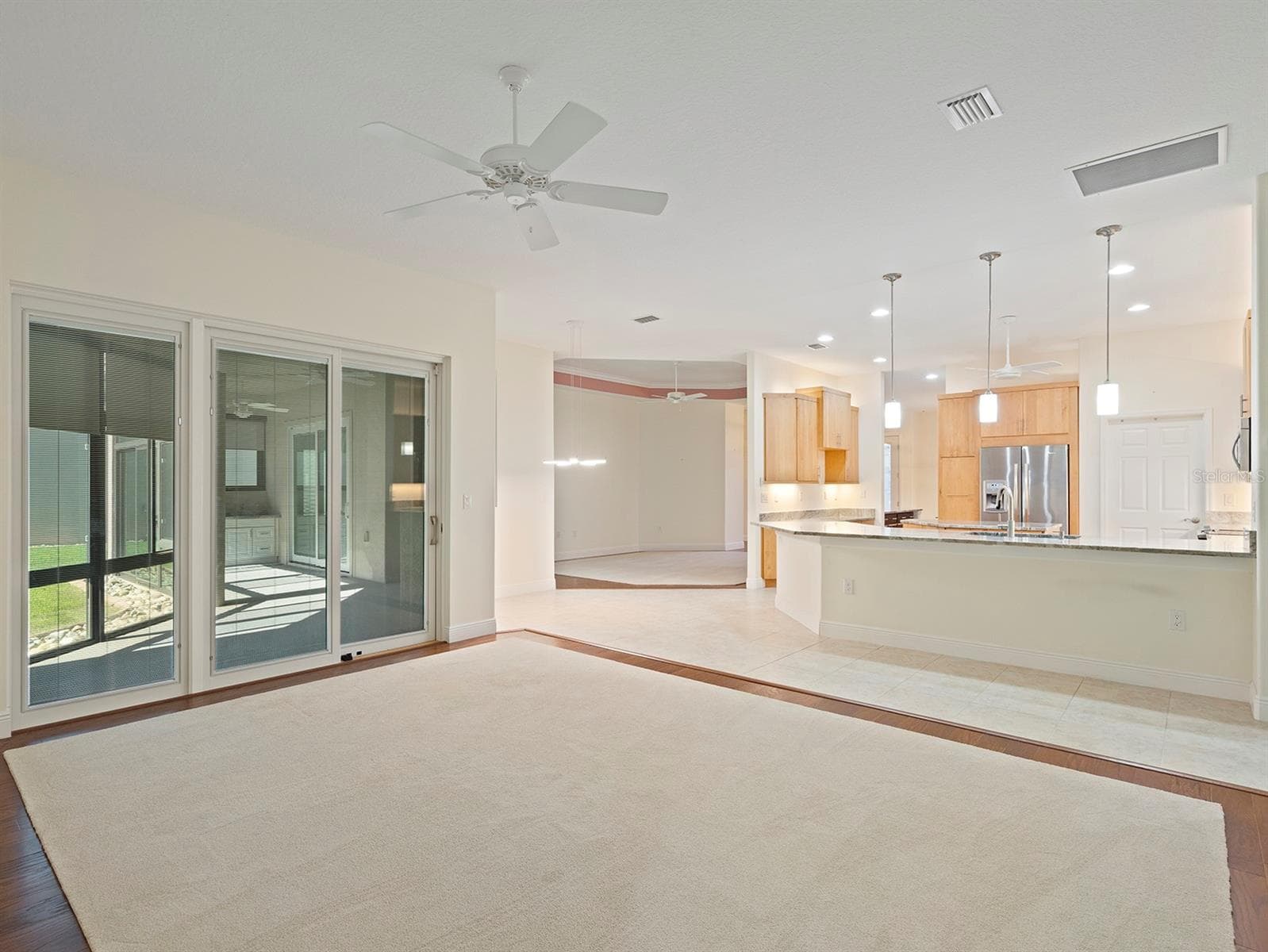 Family Room to Kitchen - 8348 BRIDGEPORT BAY CIR, MOUNT DORA
