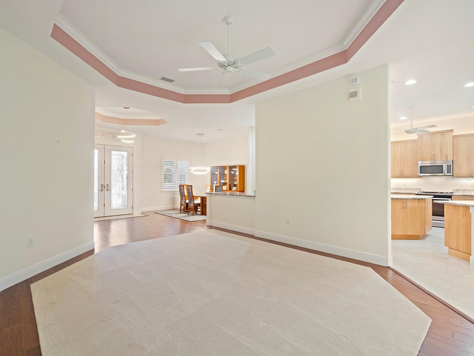 Living room to dining and kitchen - 8348 BRIDGEPORT BAY CIR, MOUNT DORA