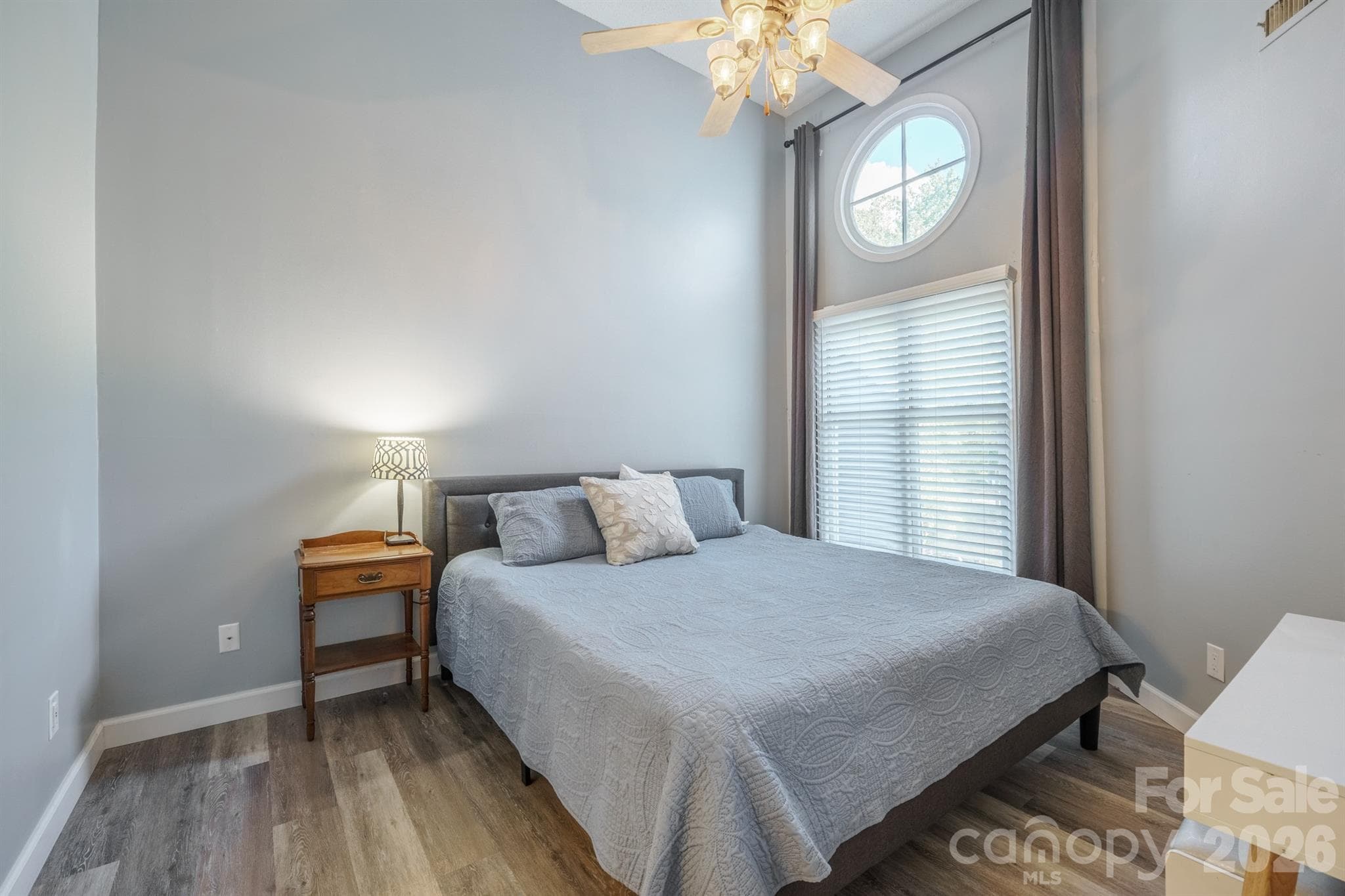 Primary BR has high ceilings and a fan and interesting porthole look window - 327 Northwest Drive, Davidson