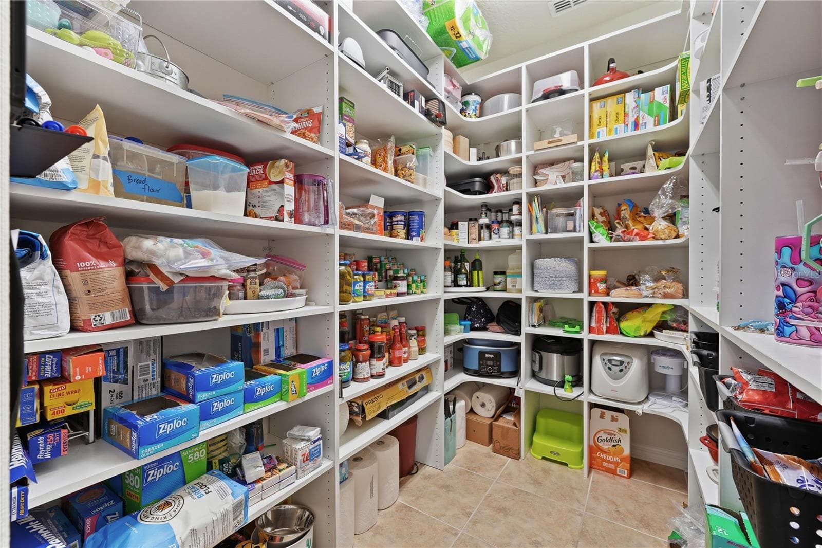 Custom shelving on the oversized, walk-in pantry. - 2873 MATERA DR, ST CLOUD