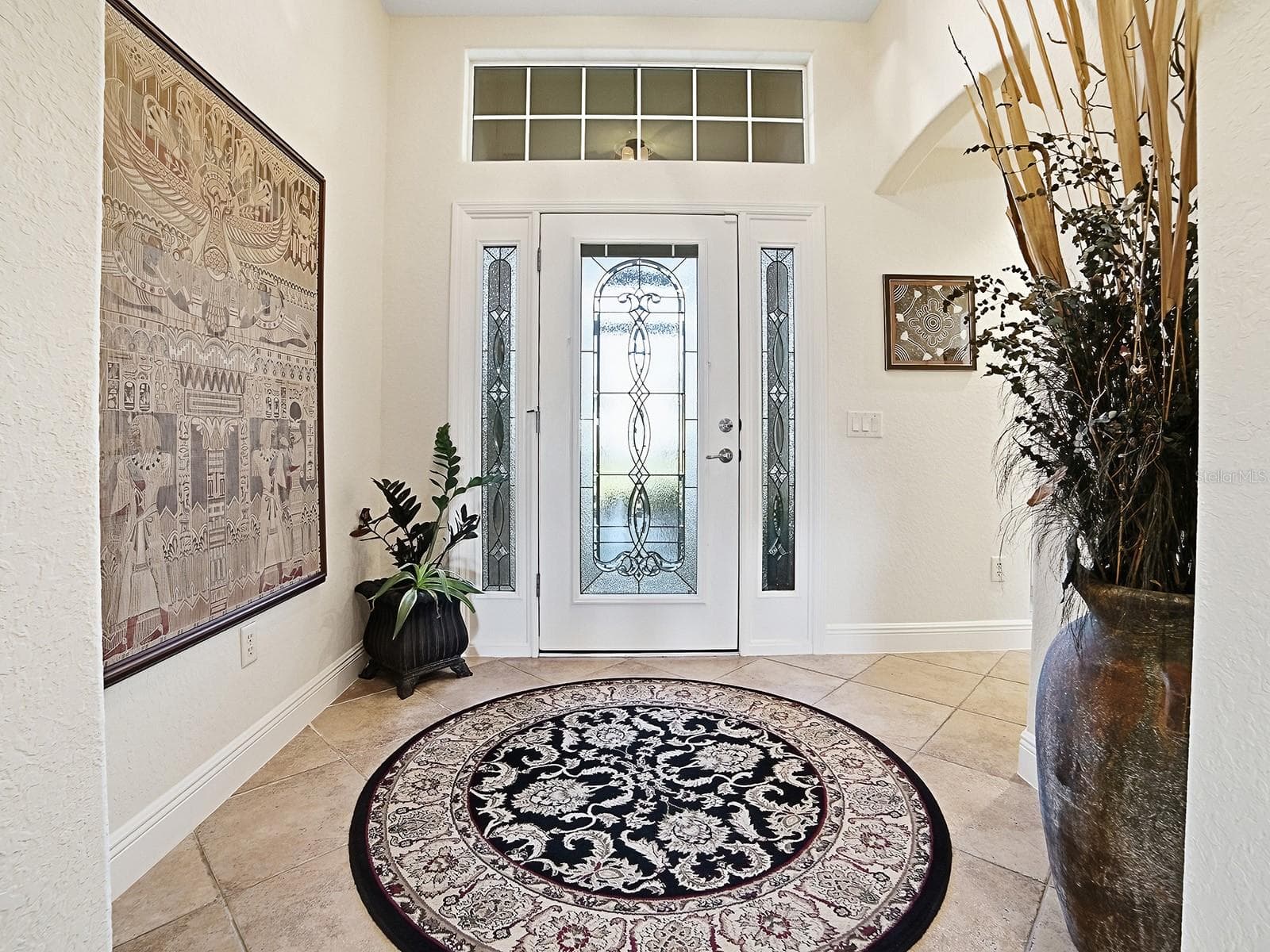 YOUR GRAND ENTRYWAY WITH NATURAL LIGHT AND LEADED GLASS DOOR - 1089 VANCE TRL, THE VILLAGES