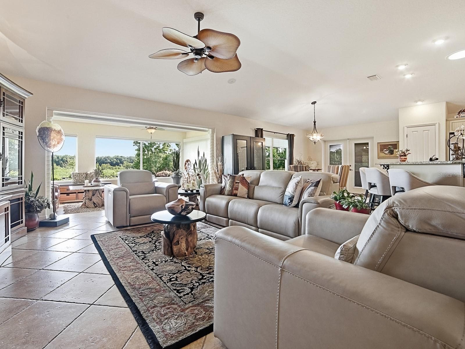 VIEW OF THE MAIN LIVING AREA TO THE OPEN KITCHEN AND YOUR PRESERVE VIEW - 1089 VANCE TRL, THE VILLAGES