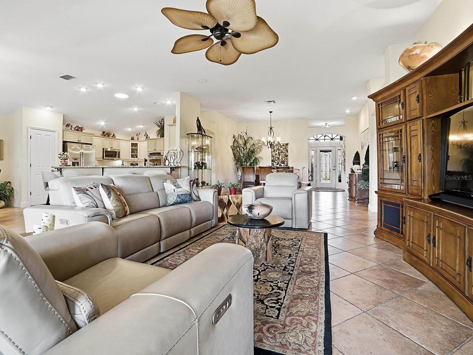 VIEW TO THE OPEN KITCHEN, DINING ROOM, AND THE FRONT FOYER - 1089 VANCE TRL, THE VILLAGES