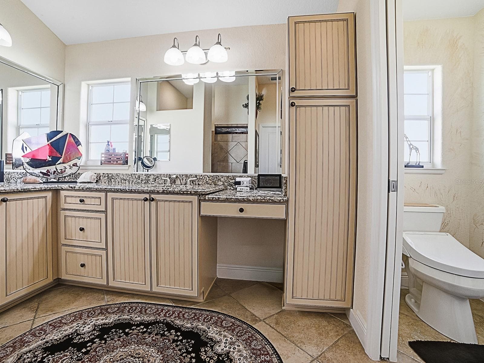 PRIMARY BATH/WATER CLOSET WITH POCKET DOOR - 1089 VANCE TRL, THE VILLAGES