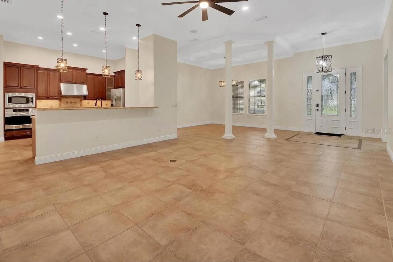 Living room with view of the Dining area - 502 VICTORIA HILLS DR, DELAND