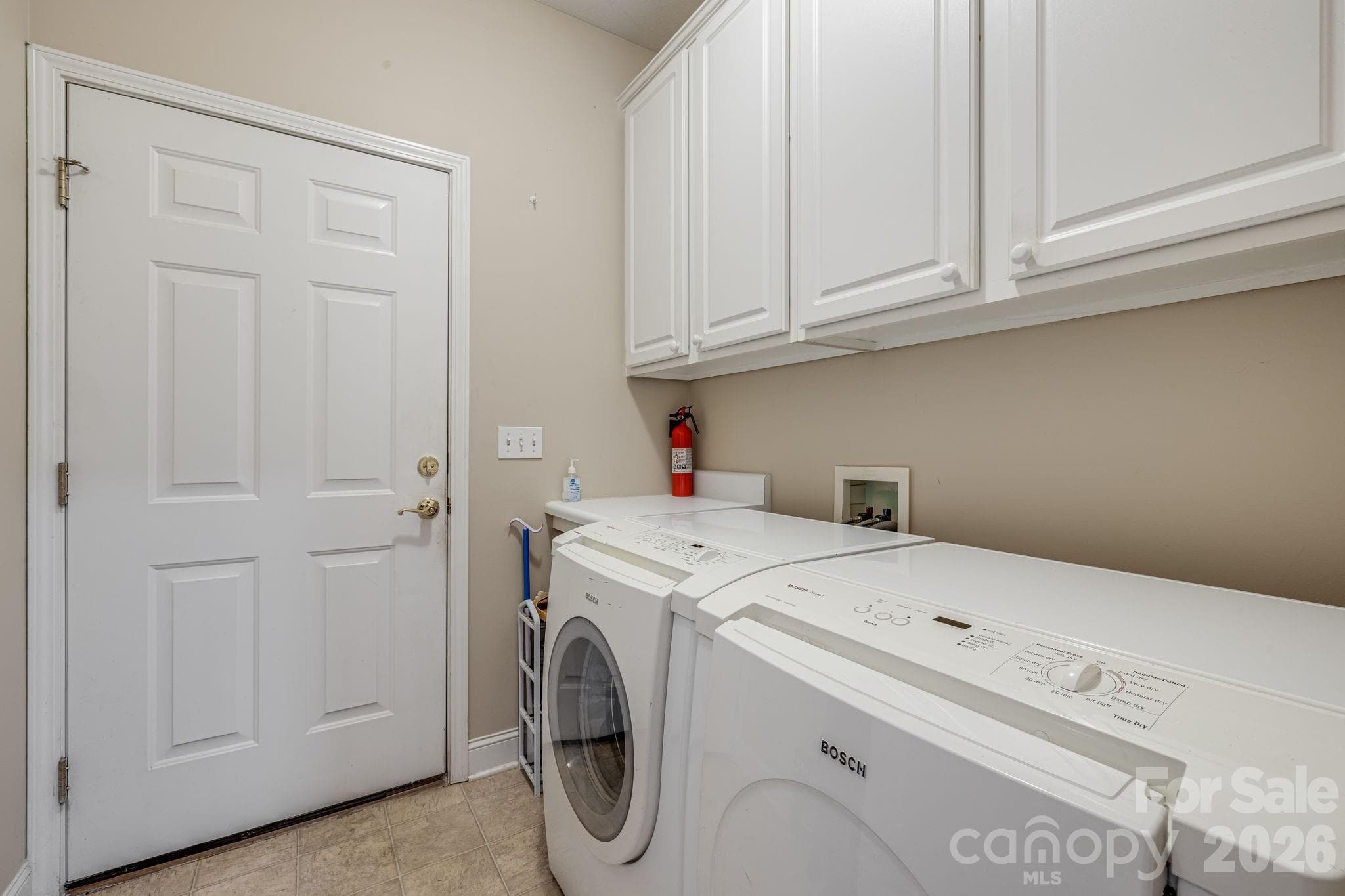 Laundry room with access to the garage. - 212 Carriage Springs Way, Hendersonville