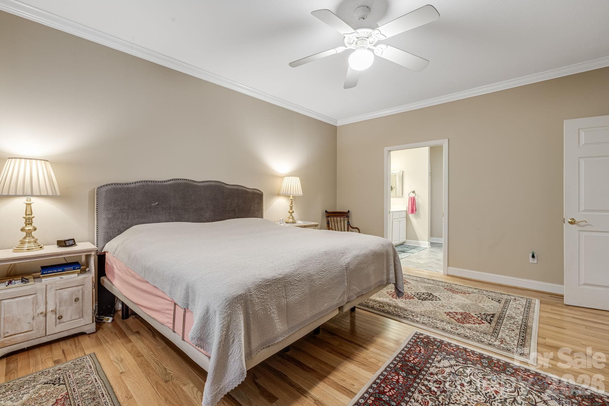 Primary bedroom view toward the private bath. - 212 Carriage Springs Way, Hendersonville