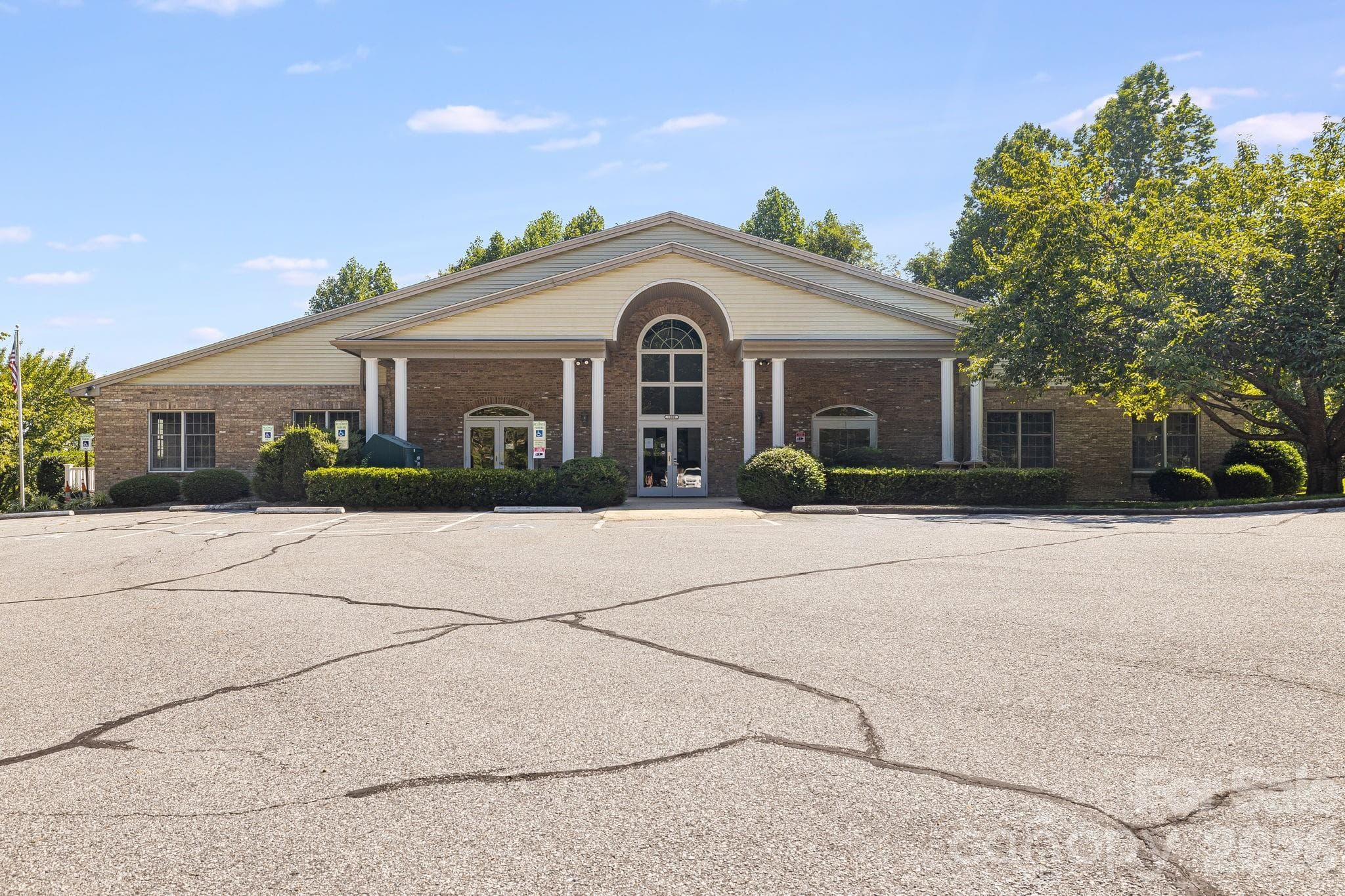 This is the neighborhood clubhouse that houses a large indoor swimming pool, a large meeting room with kitchen, and newly remodeled dressing rooms.  Also, has a deck used for entertaining that have mountain views. - 212 Carriage Springs Way, Hendersonville